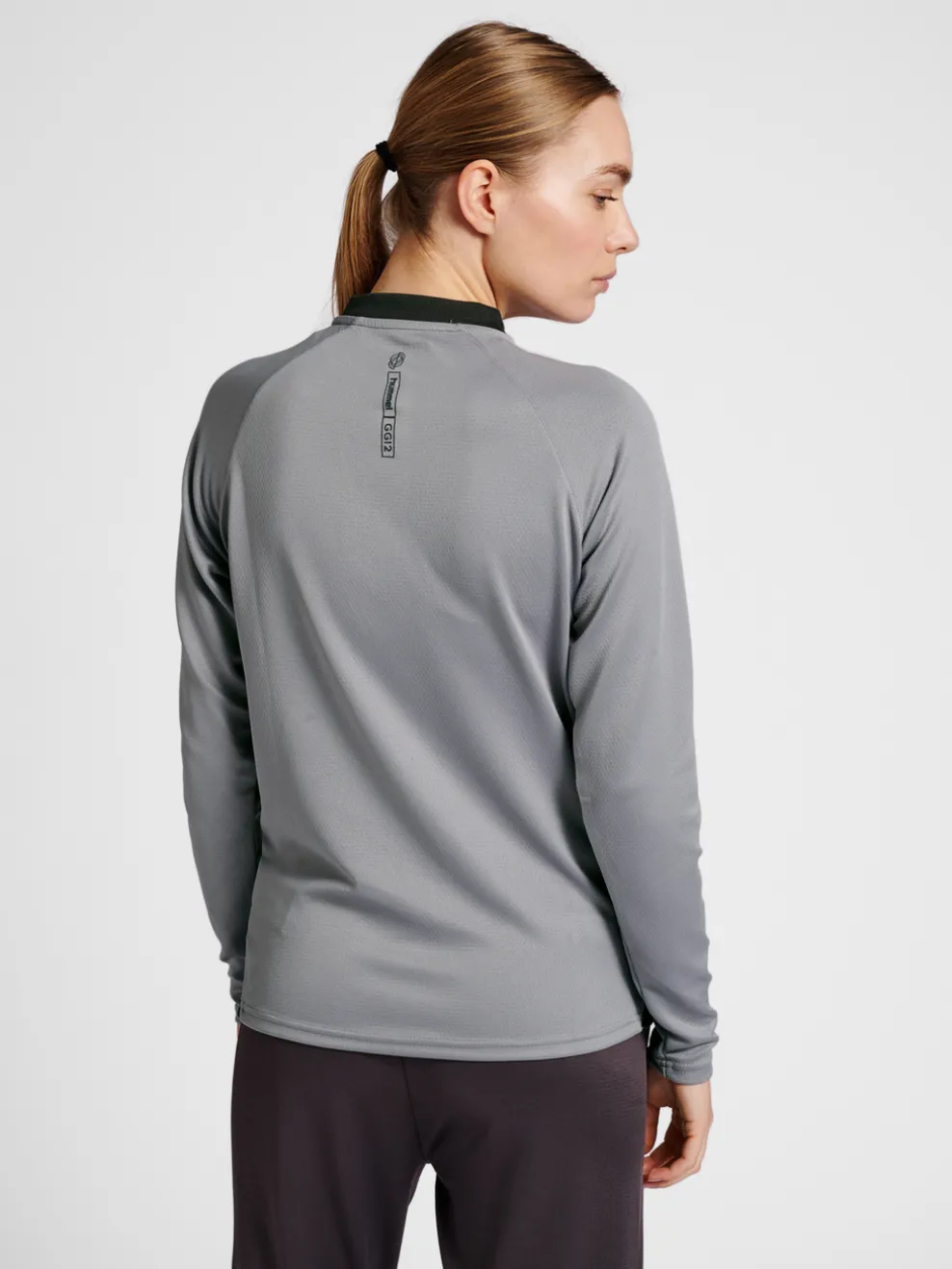 hmlGG12 ACTION HALF ZIP SWEAT WOMAN